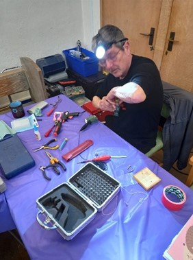Repairer John hard at work mending a much-loved Thomas the Tank Engine toy