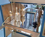 Upcycled decanter in drinks cabinet