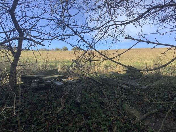 Fly tipped material in countryside